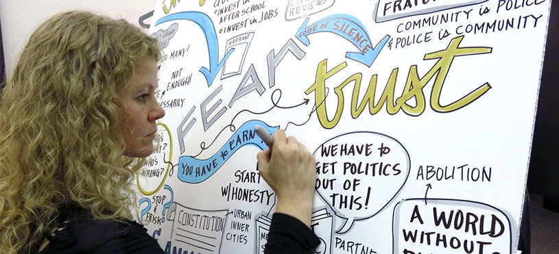 An artist draws live visual notes at Chicago Ideas Week