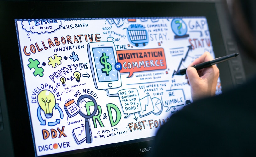 Artist works on tablet to create visual notes for a webinar